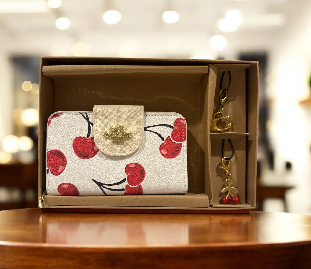 Cherry coach wallet with 2 charms